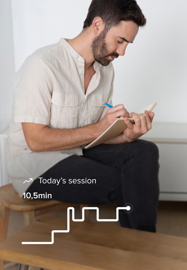 Man writing in a notebook